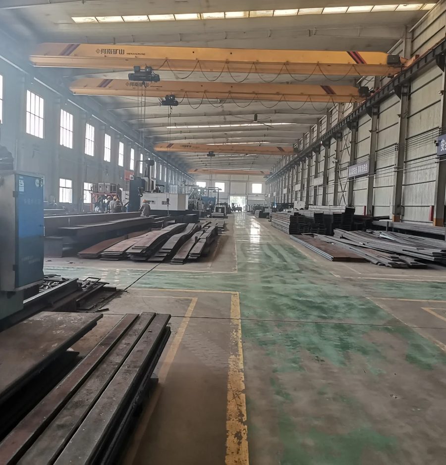 Britop factory production hall: steel storage and overhead cranes